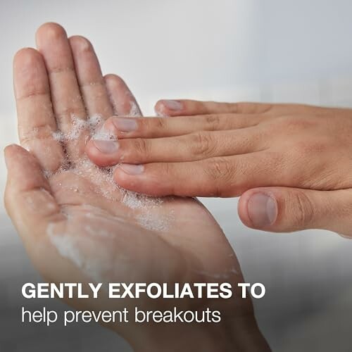 Hands applying exfoliating cleanser to prevent breakouts.